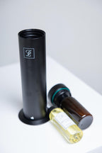 Maison Fragrance Stand Diffuser in Black. Fragrance bottles shown for illustration; inclusion is not confirmed.