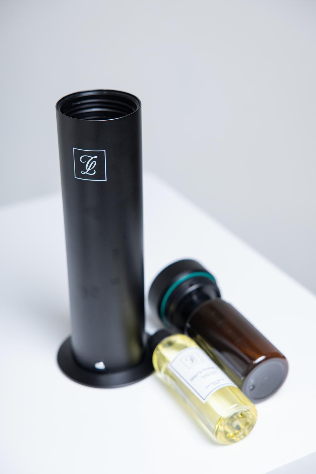 Maison Fragrance Stand Diffuser in Black. Fragrance bottles shown for illustration; inclusion is not confirmed.