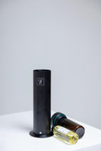 Maison Fragrance Stand Diffuser in Black. Fragrance bottles shown for illustration; inclusion is not confirmed.
