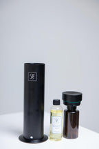 Maison Fragrance Stand Diffuser in Black. Fragrance bottles shown for illustration; inclusion is not confirmed.