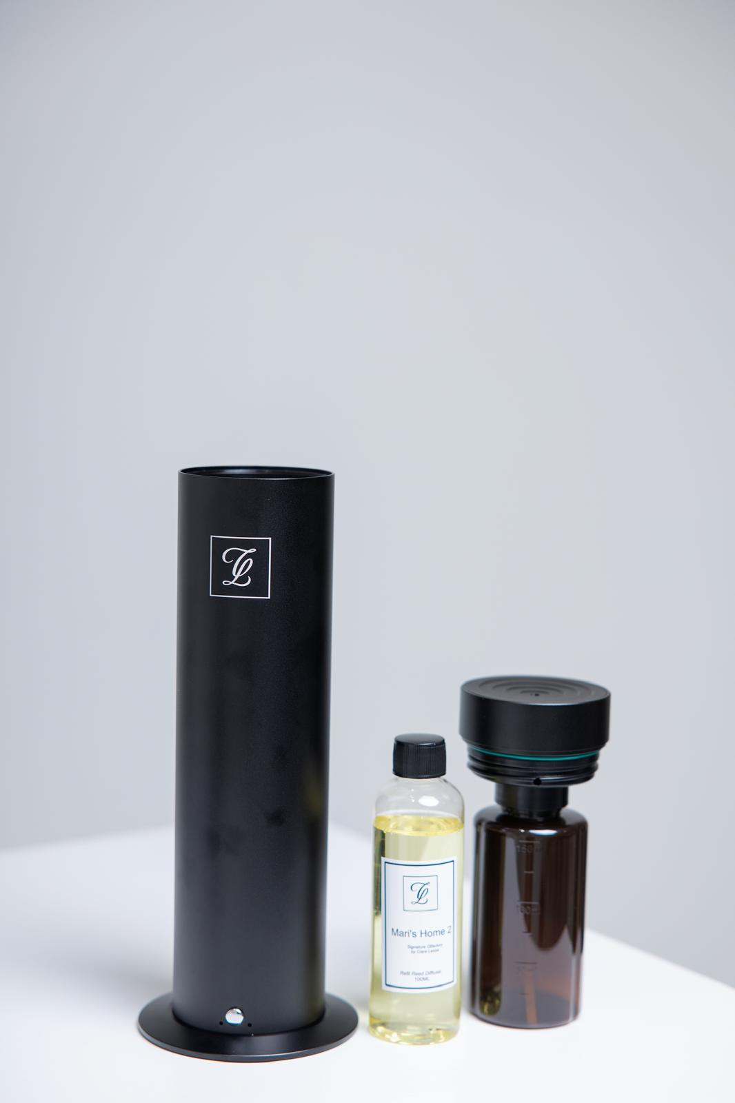 Maison Fragrance Stand Diffuser in Black. Fragrance bottles shown for illustration; inclusion is not confirmed.
