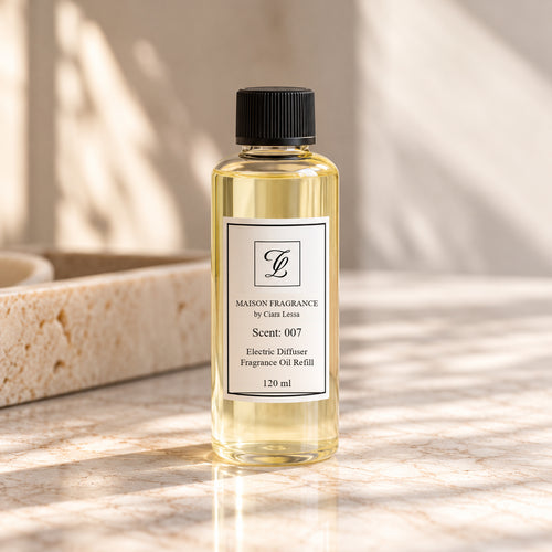 Maison Fragrance by Ciara Lessa Electric Diffuser Fragrance Oil Refill, Scent 007, 120 ml, in a clear cylindrical bottle with a black ribbed cap.