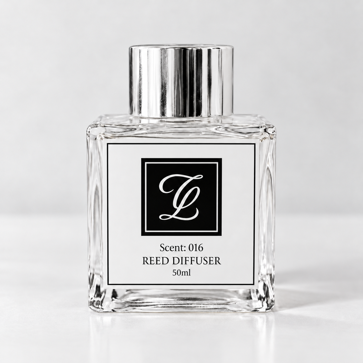 Maison Fragrance Scent 016 Reed Diffuser, 50ml, compact square clear glass bottle with silver cap on a light neutral background.