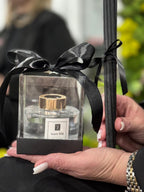 Maison Fragrance Scent 018 Reed Diffuser in its clear presentation box with black ribbon and reeds. Provisional label representation.