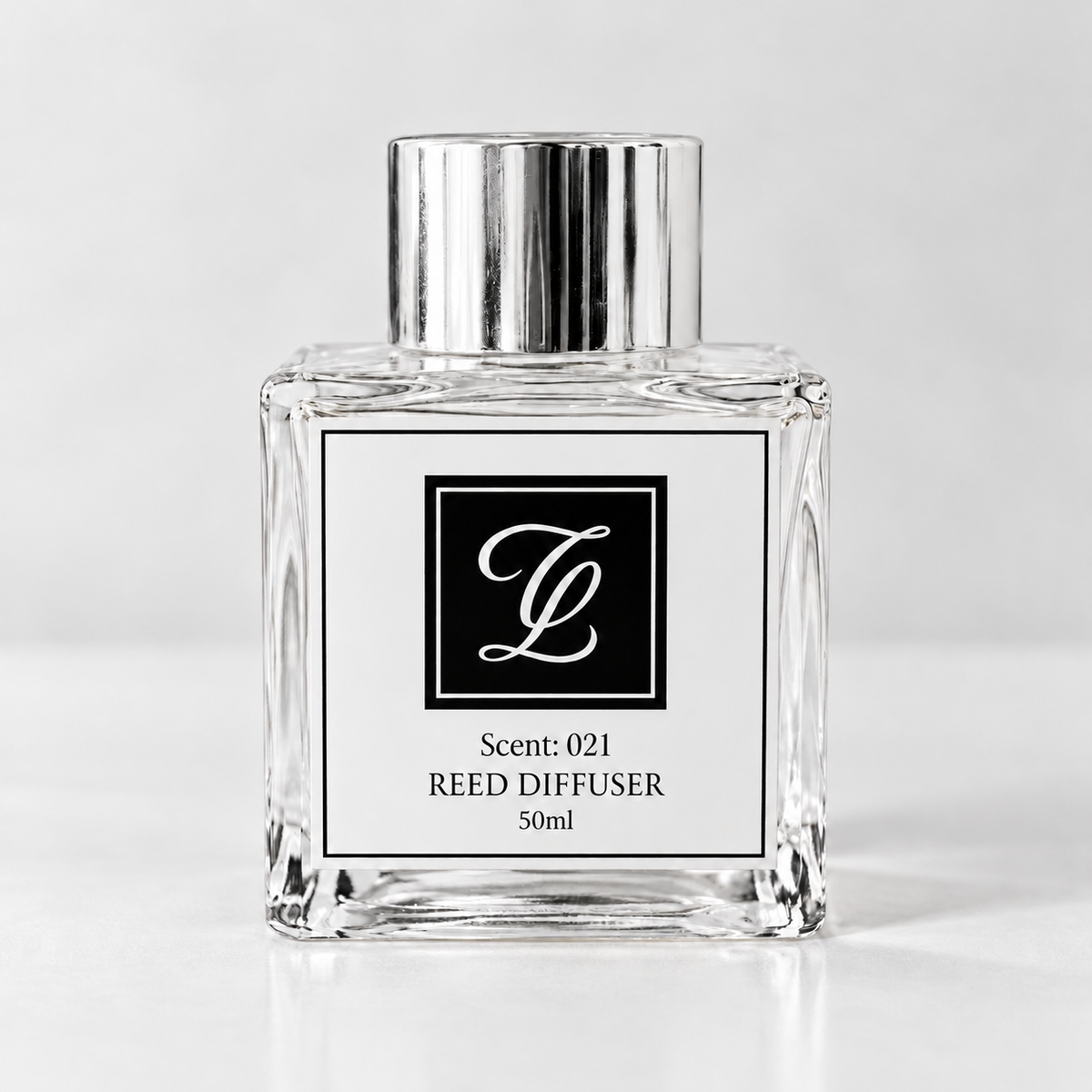 Maison Fragrance Scent 021 Reed Diffuser, 50ml, compact square clear glass bottle with silver cap on a light neutral background.
