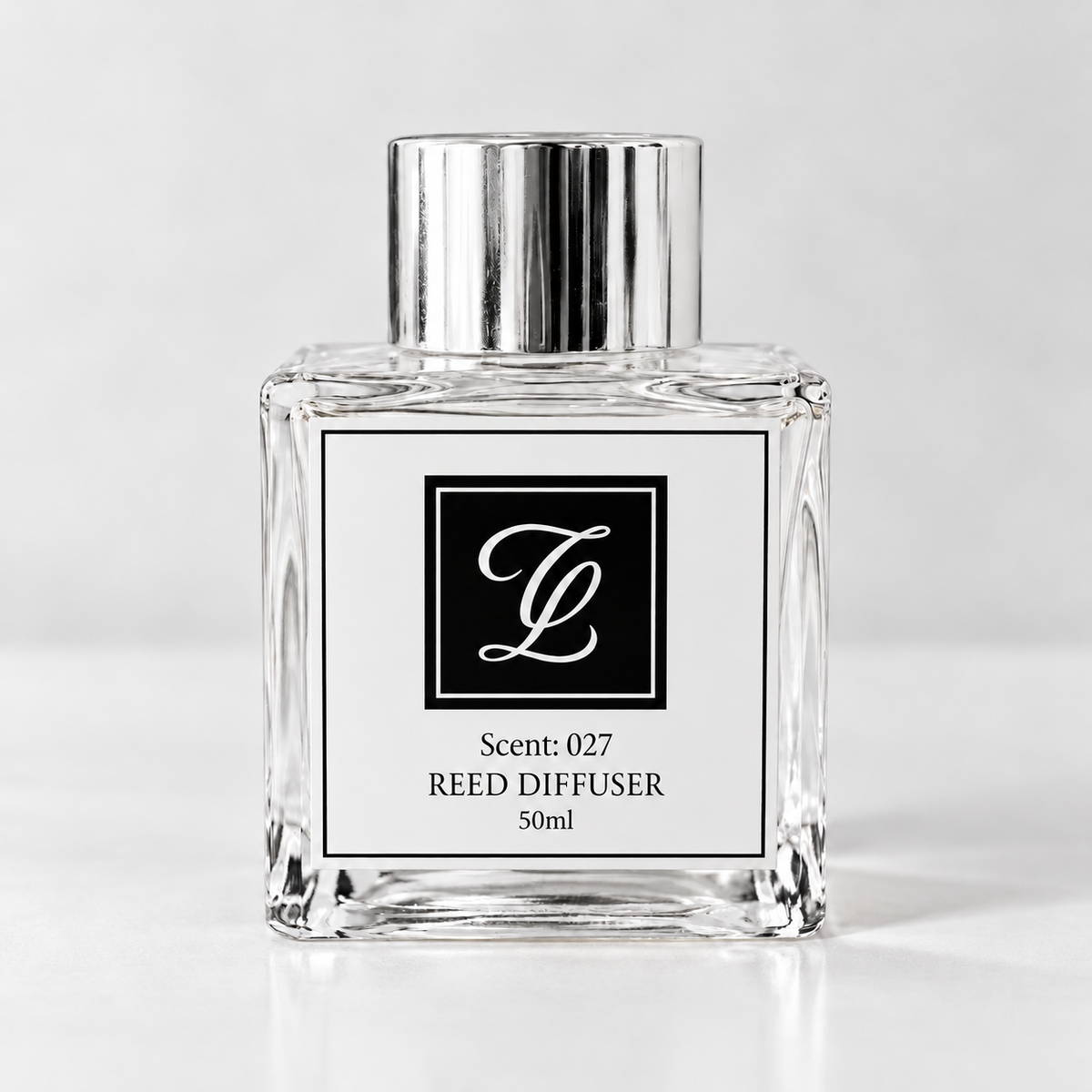 Maison Fragrance Scent 027 Reed Diffuser, 50ml, compact square clear glass bottle with silver cap on a light neutral background.