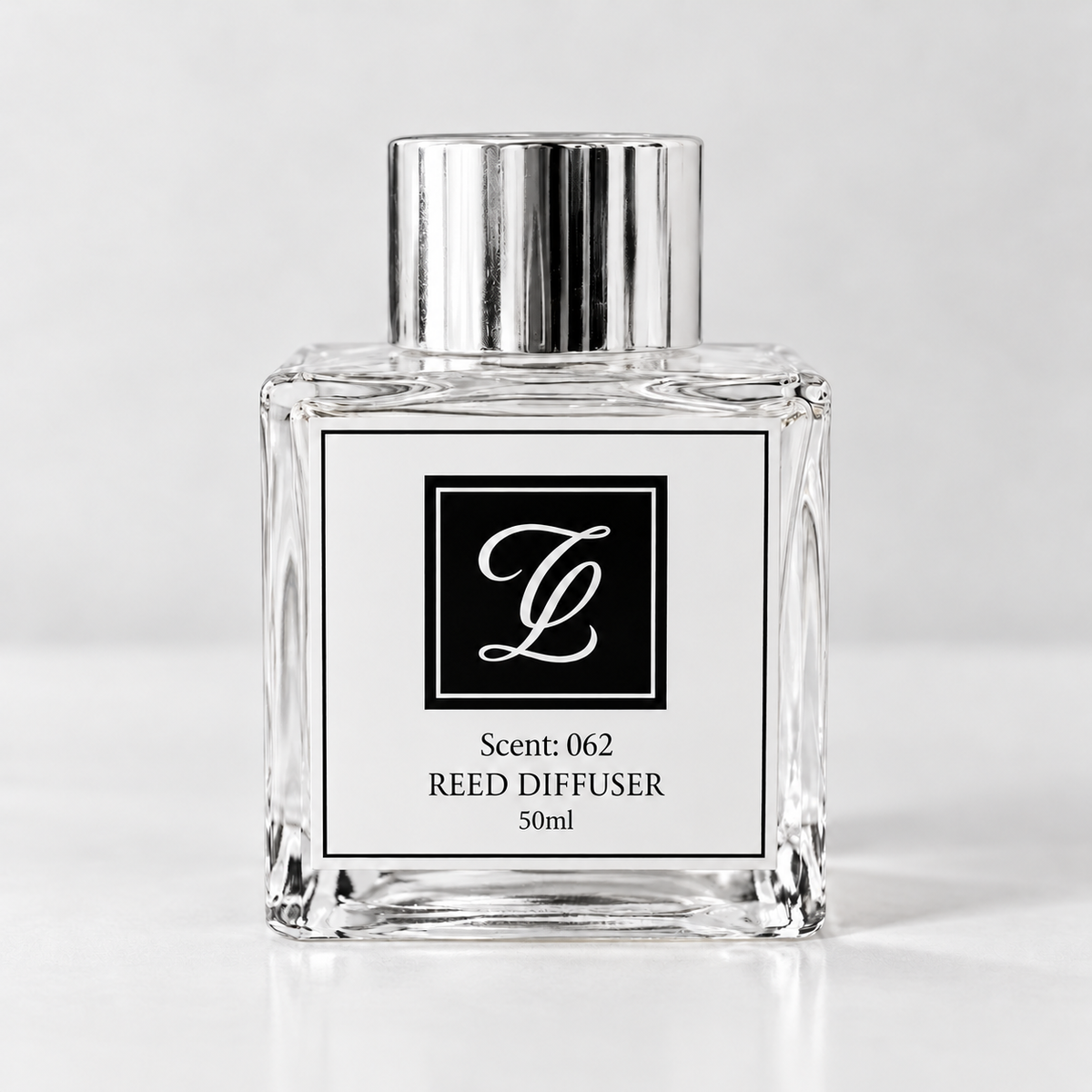 Maison Fragrance Scent 062 Reed Diffuser, 50ml, compact square clear glass bottle with silver cap on a light neutral background.