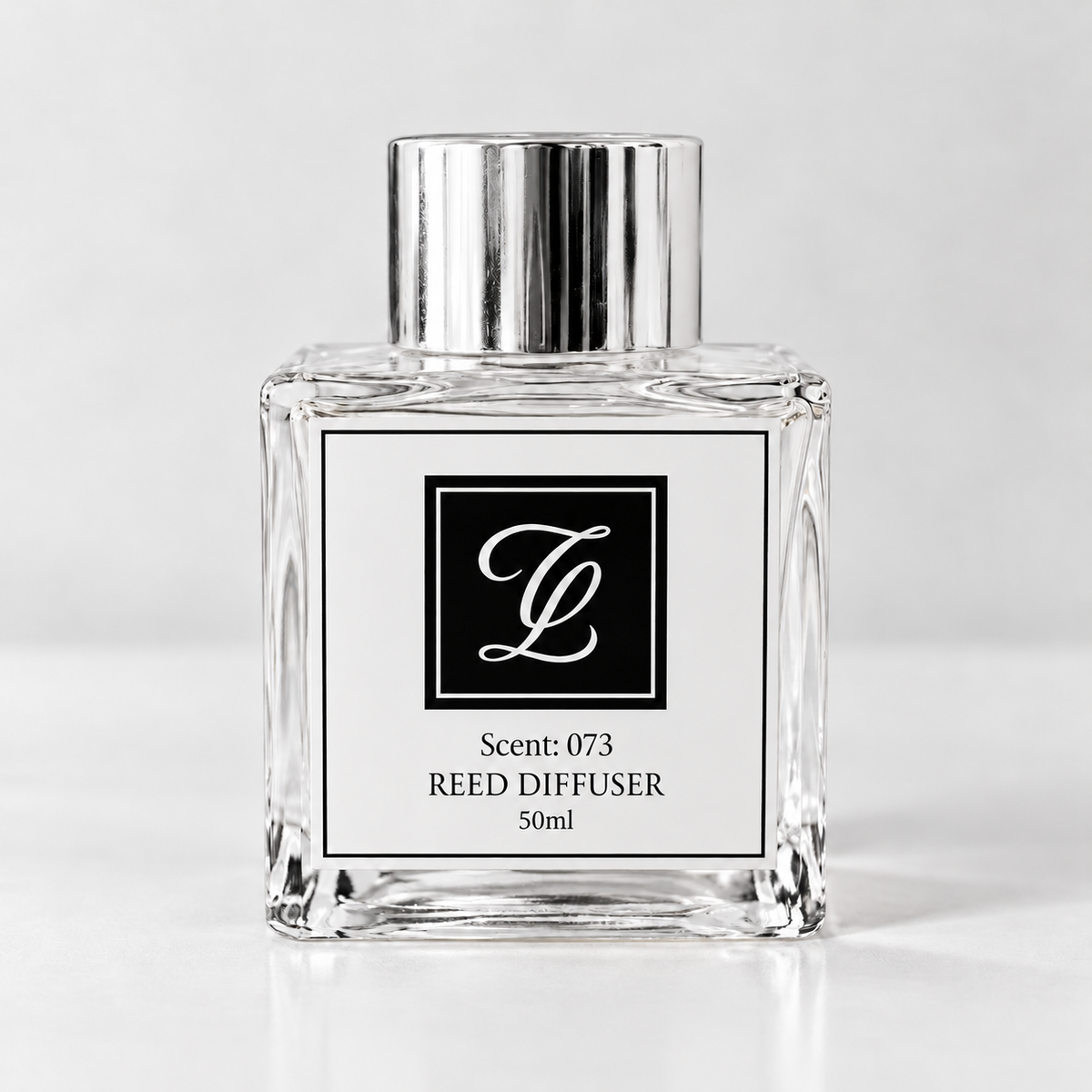 Maison Fragrance Scent 073 Reed Diffuser, 50ml, compact square clear glass bottle with silver cap on a light neutral background.