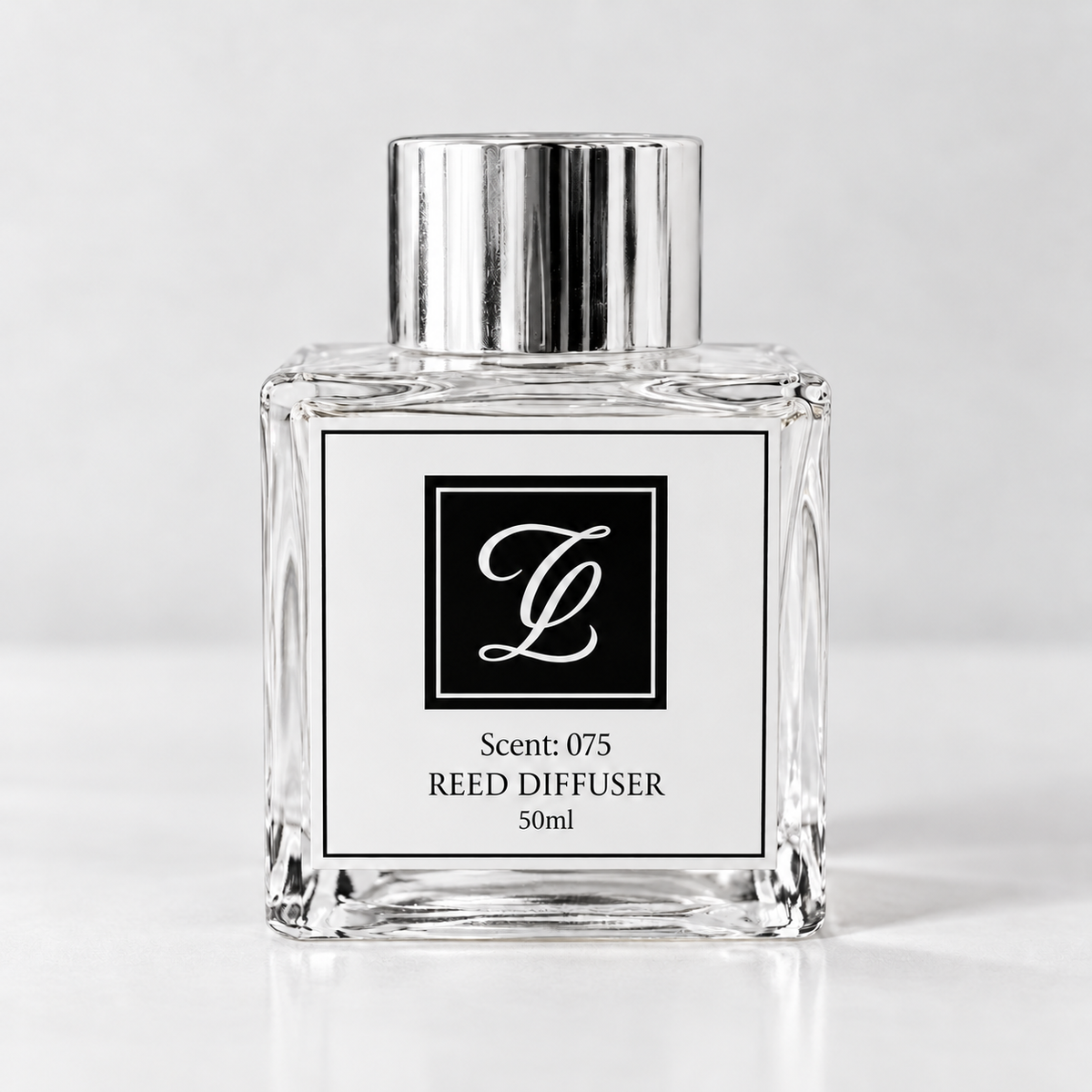 Maison Fragrance Scent 075 Reed Diffuser, 50ml, compact square clear glass bottle with silver cap on a light neutral background.