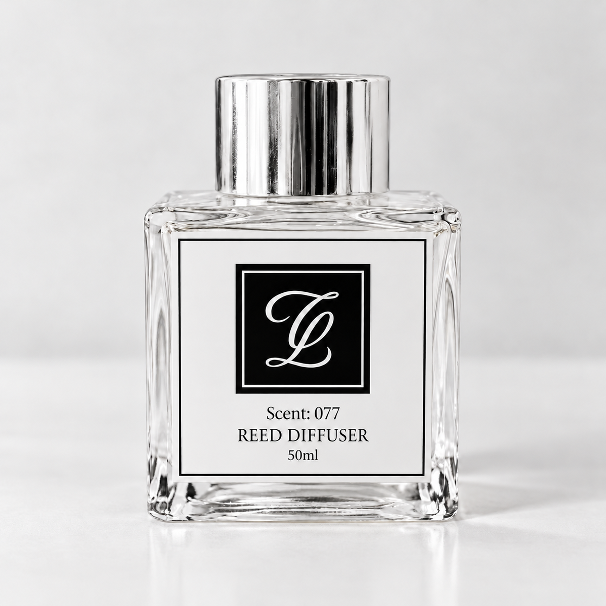 Maison Fragrance Scent 077 Reed Diffuser, 50ml, compact square clear glass bottle with silver cap on a light neutral background.
