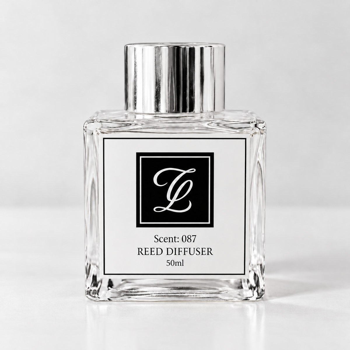 Maison Fragrance Scent 087 Reed Diffuser, 50ml, compact square clear glass bottle with silver cap on a light neutral background.
