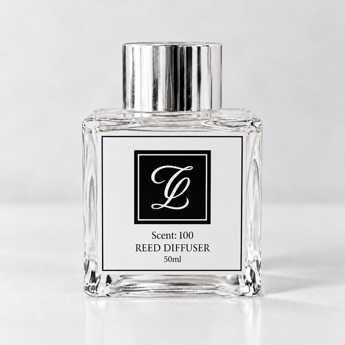 Maison Fragrance Scent 100 Reed Diffuser, 50ml, compact square clear glass bottle with silver cap on a light neutral background.
