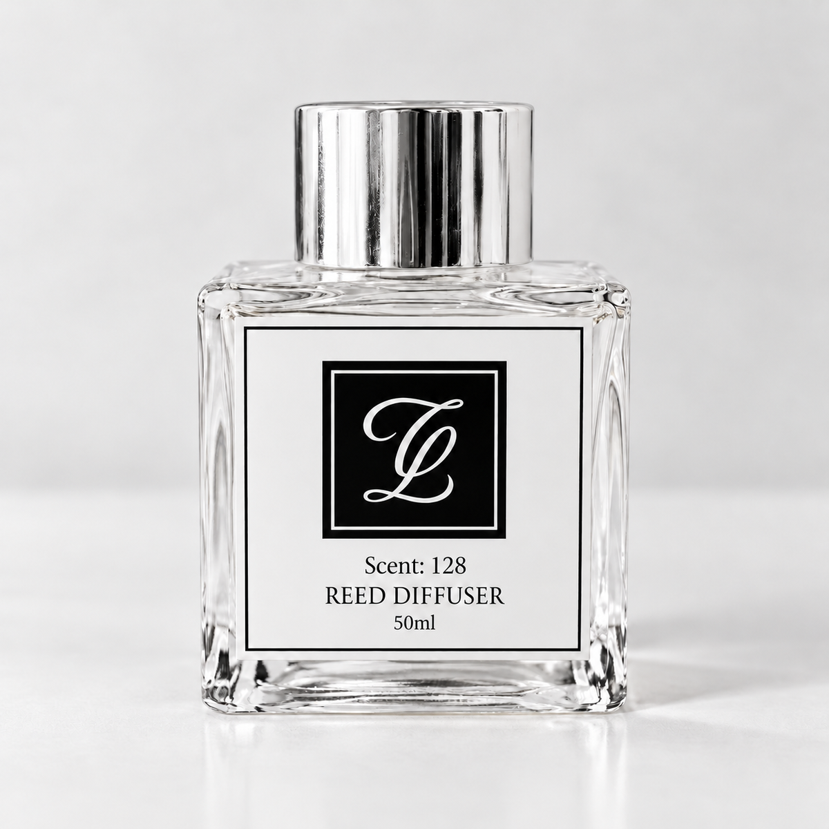 Maison Fragrance Scent 128 Reed Diffuser, 50ml, compact square clear glass bottle with silver cap on a light neutral background.