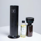 Maison Fragrance Stand Diffuser in Black. Fragrance bottles shown for illustration; inclusion is not confirmed.