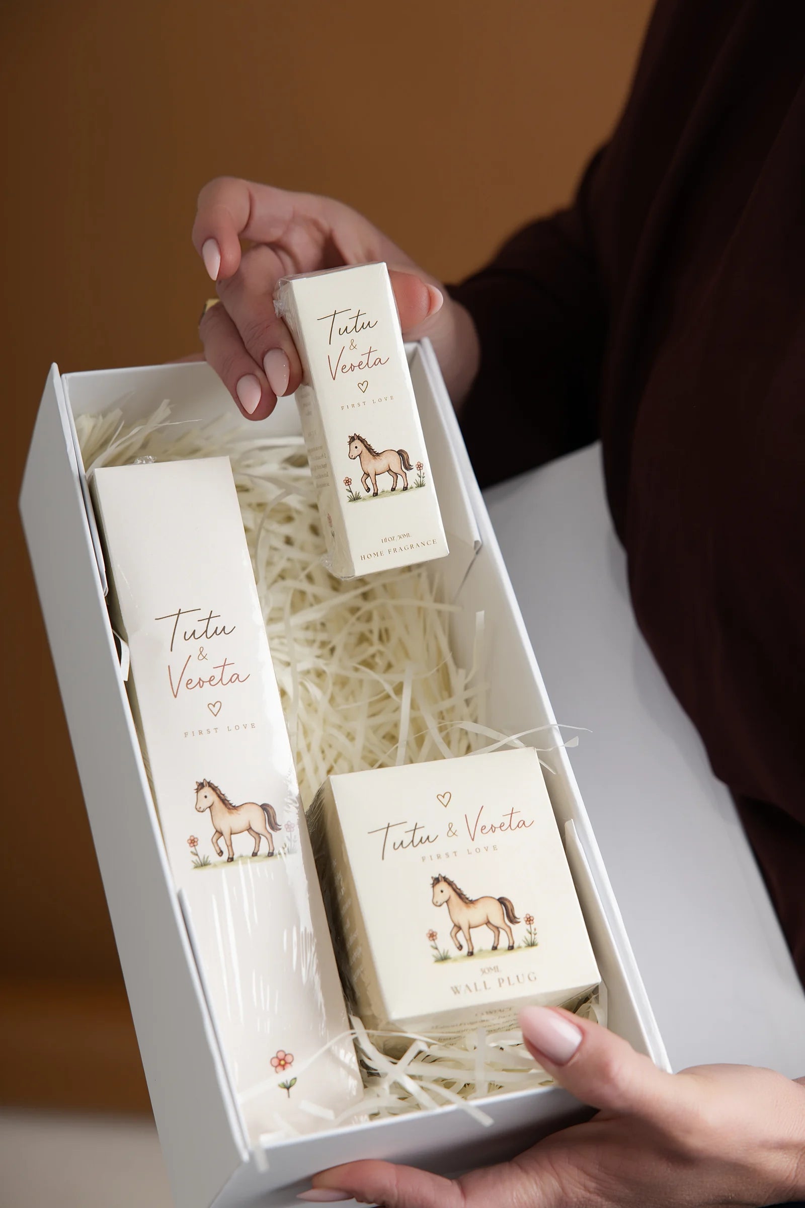 Open Tutu & Veveta gift box with horse illustrations and the three fragrance products