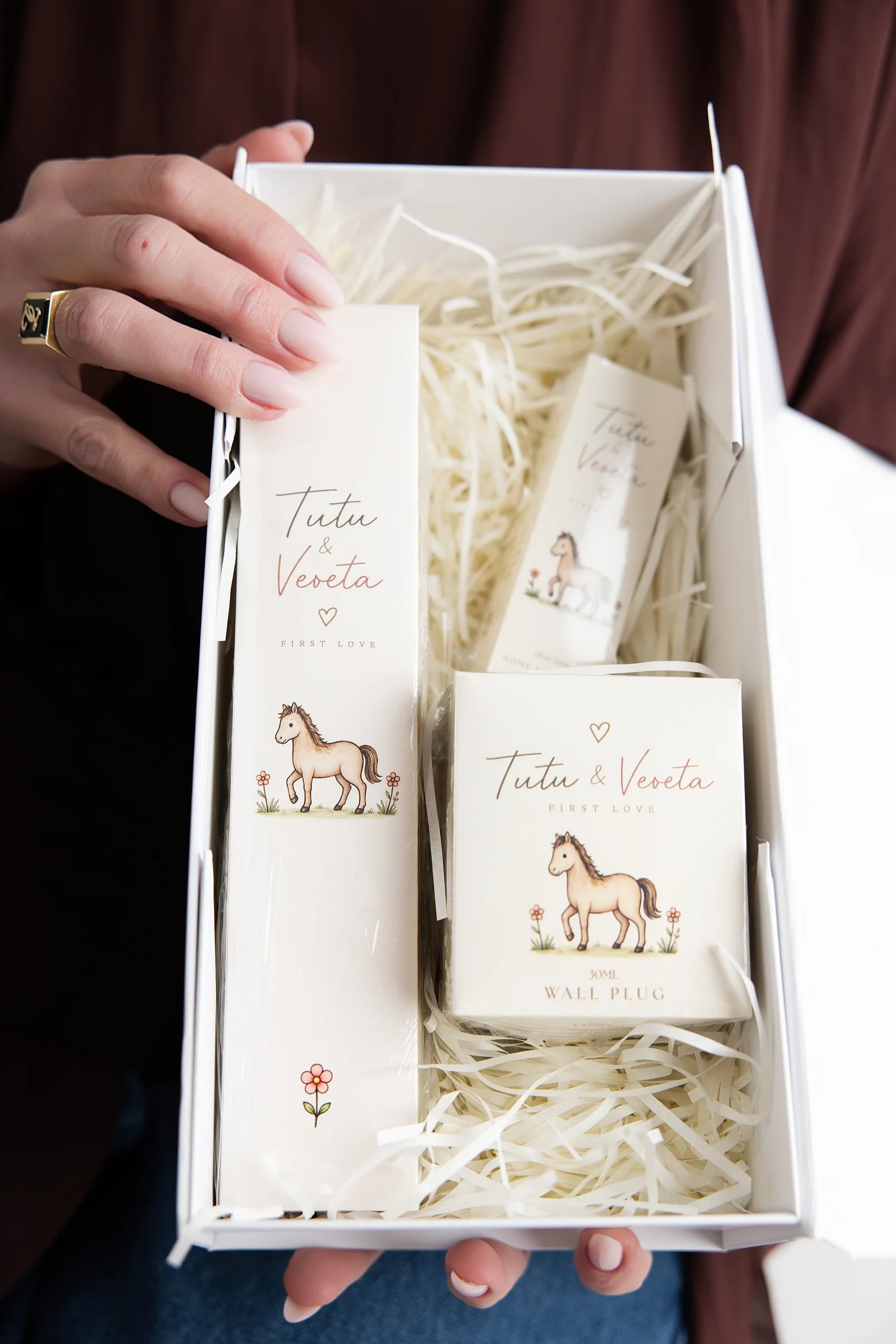 Open Tutu & Veveta gift box with horse illustrations and the three fragrance products
